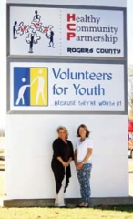Trisha DeLozier, Healthy Community Partnership prevention specialist, and Melynda Stone, Volunteers for Youth ­executive ­director, stand in front of the building that houses the two non-profits. The two entities have joined forces to combat ­substance abuse in  Rogers County.