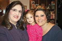 “Six months after knee surgery and feeling great,” says Kathy Carpenter, here with her granddaughter Elizabeth Caroline and daughter Kelly Morrison.