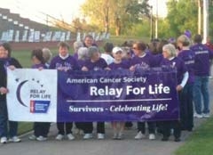 Cancer survivors line up on the RSU campus last year to lead the first lap of the Rogers County Relay For Life. This is an inspirational time when survivors circle the track ­together and help everyone celebrate the victories they have achieved over cancer.
