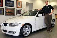 BMW of Tulsa Service Manager Mike Whitney shows off the BMW 335 Performance Edition on display in the boutique display area.