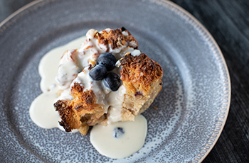 White Chocolate & Blueberry Bread Pudding with Amaretto Cream Sauce