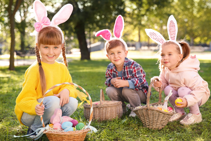 Cute kids hunting Easter eggs.