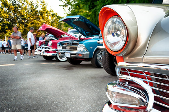 Closeup photo of a vintage car show.